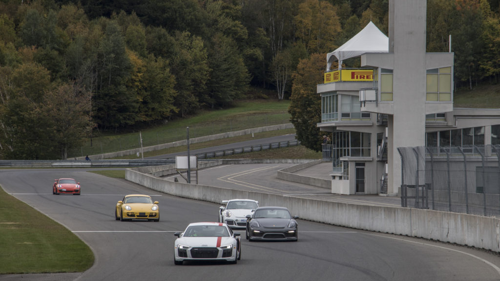 A group of the sports cars of different models at a racing track