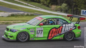 A green color racing car with Outline Tag