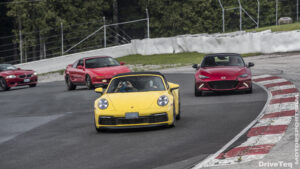 A yellow color car racing on a race track