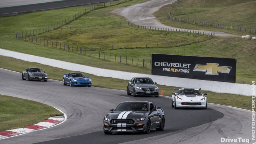 A group of luxurious cars racing with each other
